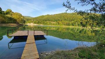 Фото номера Дом с 2 спальнями Дома для отпуска Cabana Lac Paltinu si Padure Valea Doftanei г. Teşila 40